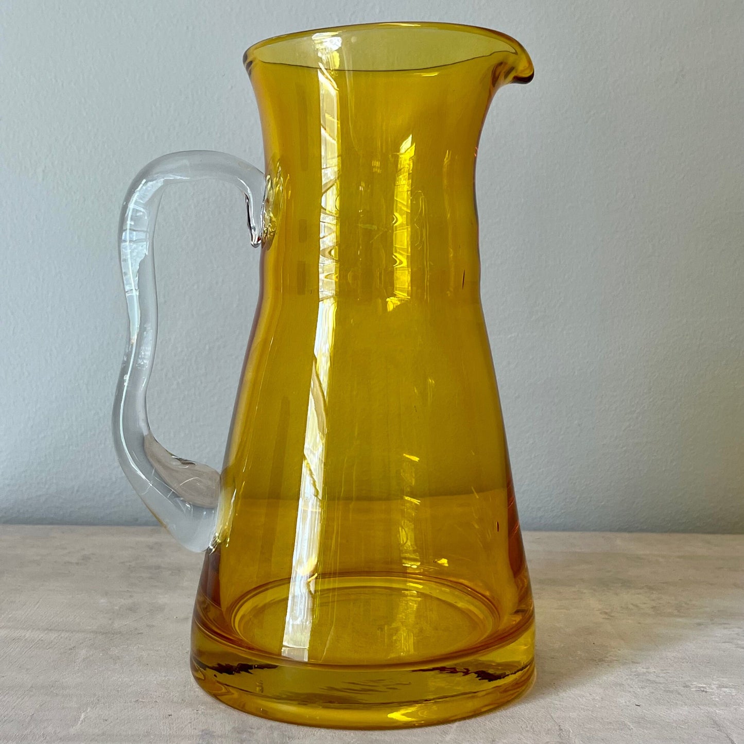 Amber Colored Glass Pitcher with Asymmetric Handle