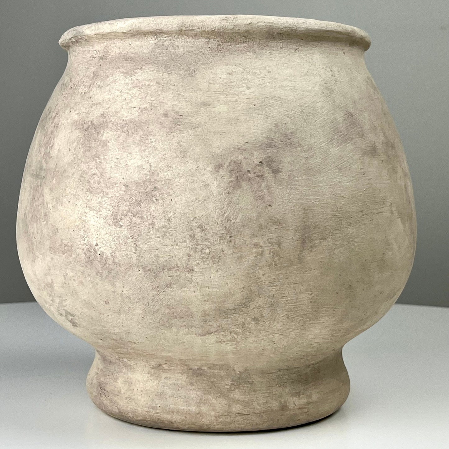 Cream Colored Aged Vase with Pedestal Base