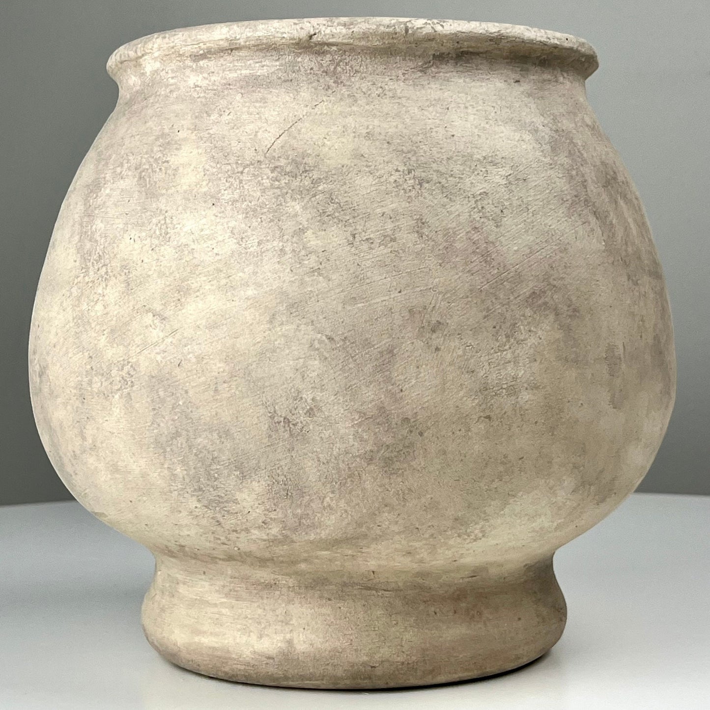 Cream Colored Aged Vase with Pedestal Base